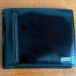 Tumi Amalfi Series Glossy Black Leather Wallet.